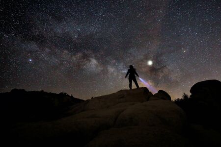 Girl Light Painted in the Desert Under the Night Skyの写真素材