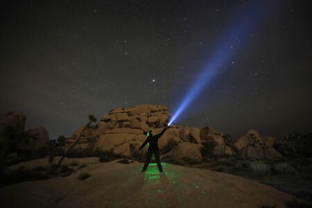 Girl Light Painted in the Desert Under the Night Skyの写真素材