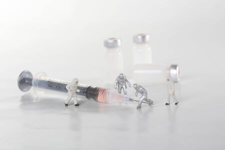 Medical Concept of  Needle and Vaccine Bottles Representing Public Safetyの写真素材