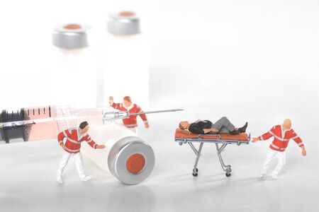 Medical Concept of  Needle and Vaccine Bottles Representing Public Safetyの写真素材