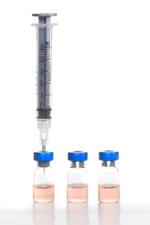 Medical Concept of  Needle and Vaccine Bottles Representing Public Safetyの写真素材