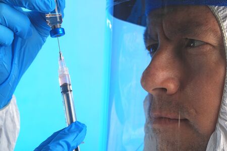 Male Lab Technician Working to Fight Global Pandemicの写真素材