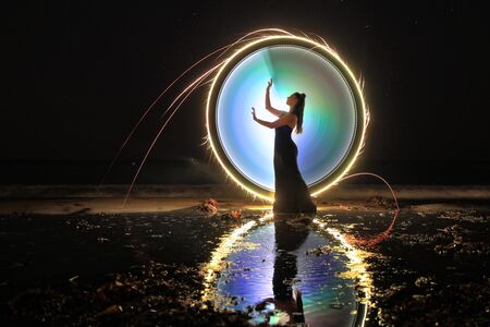 Creative Light Painting Girl With Color and Tube Lightingの写真素材