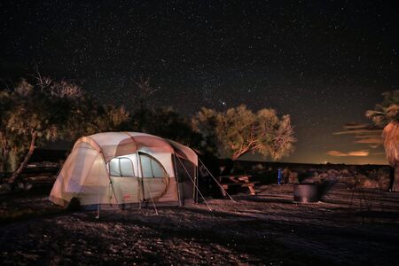 Camping at Night Under the Stars and Milky Wayの写真素材