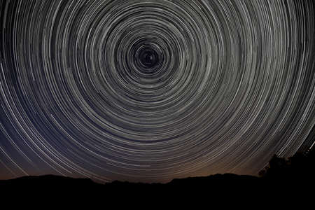 Camping at Night With Star Trails in Joahua Tree National Parkの写真素材