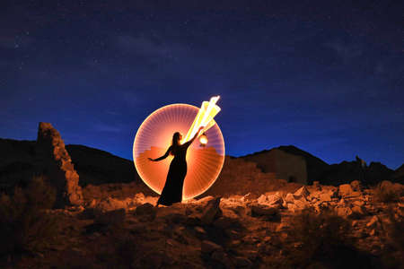 Beautiful Woman Model Posing in the Desert at Nightの写真素材