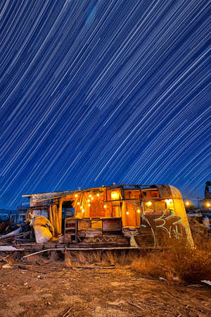 Abandoned Trailer Under Convergence Star Trails in Bombay Beachの写真素材