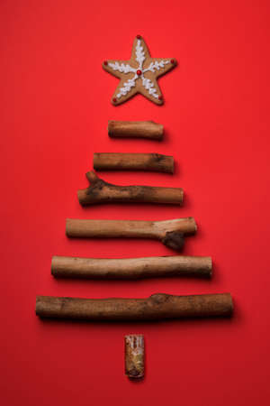 Wood Stick Christmas Tree on Red Holiday Background