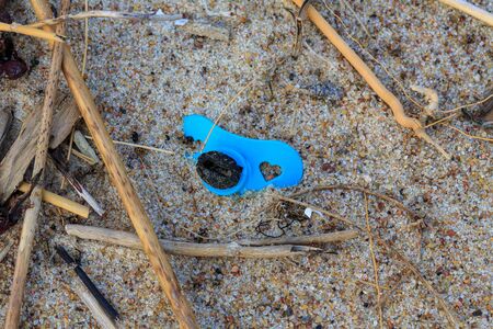 Remain of a pacifier lying on a beach