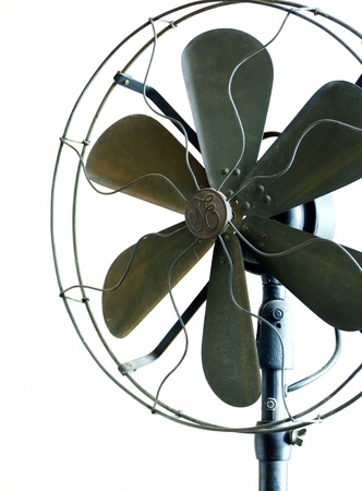 Beautiful black antique brass fan on a white background の写真素材