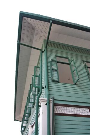  green wooden house on a white background の写真素材