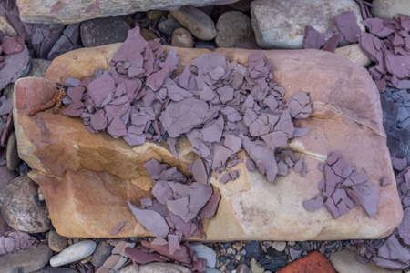 Fragments of slate on rocks, a the River Goyt at Stockport Hydro community hydroelectric plant, Stockport, Cheshire UK.の写真素材