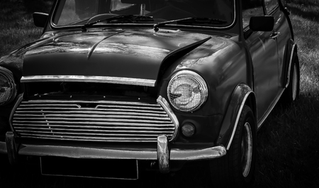 This photo was taken in Donnington, Leicestershire / United Kingdom - May 5, 2018: The front headlight of a classic Mini car.のeditorial素材