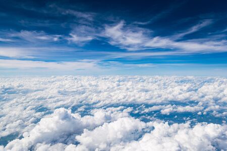 Cloud above the blue sky from airplane window