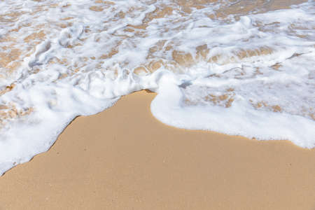 A wave coming up on the shore lineの写真素材