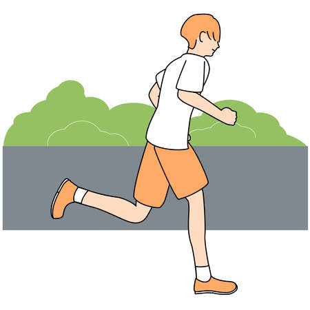 A young man with orange hair is running.の写真素材