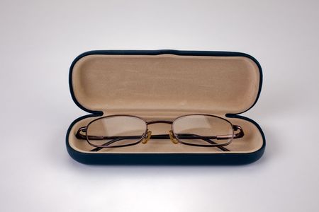 A pair of reading glasses in a case.の写真素材