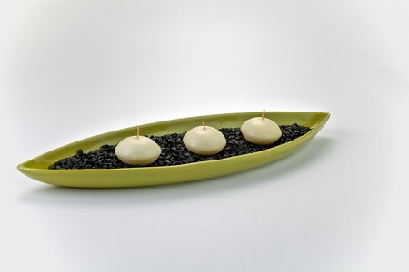 A candle boat with three candles on isolated background.の写真素材