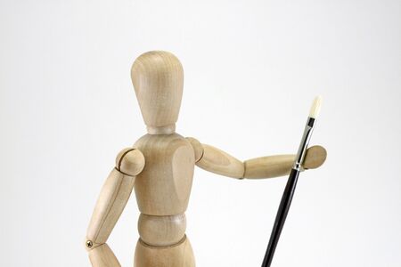 Closeup of artist manikin and artist brushの写真素材