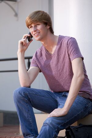 Young Man using a Cell Phoneの写真素材