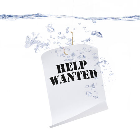 Fish Hook with a Help Wanted Sign Under Waterの写真素材