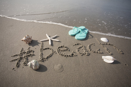 #beach written in the sand at the ocean