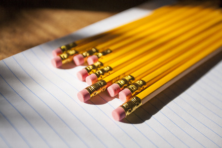 school notebook paper and pencil on wood deskの写真素材
