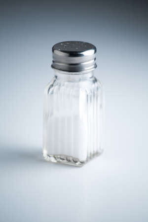 Vintage Salt Shaker on White Background with Shadowsの写真素材