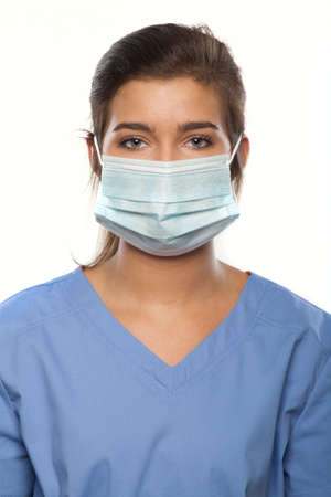 Young Woman Wearing Medical Scrubs and a Surgical Maskの写真素材