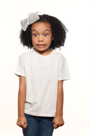 Cute Young Expressive African American Girl on a White Backgroundの写真素材