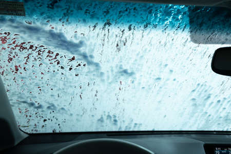 Drive Through Car Wash from Inside an Automobile Being Washedの写真素材
