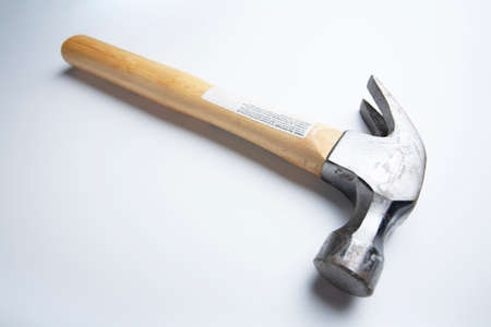 Wide Angle Photograph of a Handheld Hammer on a White Backgroundの写真素材