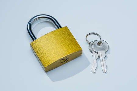 Simple Gold Lock and Keys on White Backgroundの写真素材