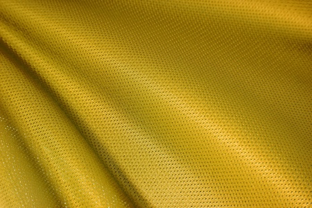 closeup of gold jersey fabric textureの写真素材