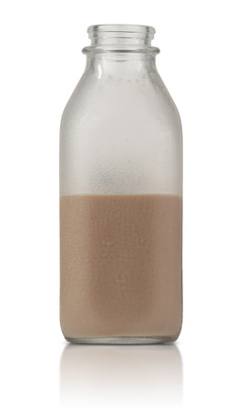 cold frosty glass quart bottle half filled with chocolate milk with condesationの写真素材