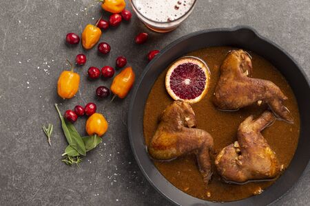 blood orange and cranberry broasted chicken wingsの写真素材