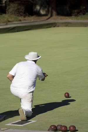 male senior citizen rolls the bowl during a tournamentの写真素材
