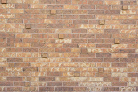 brick wall texture with bricks sticking out from wallの写真素材