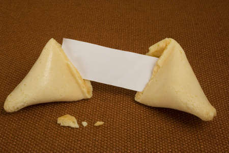 broken fortune cookie with white paper for messageの写真素材