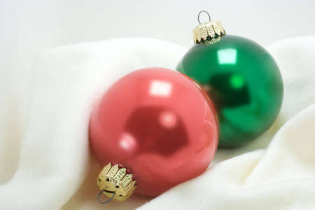red and green Christmas ornament wrapped in soft cotton fabricの写真素材