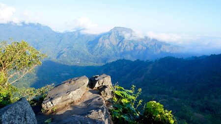 Looking over a valley from a high point of view on a mountain at midday.の写真素材