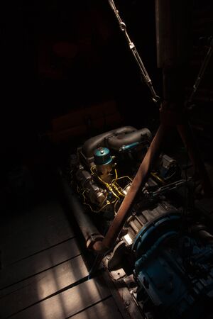 Engine of on board small boat to give power to the vessel to move forward or backwards on the water at see or river.の写真素材
