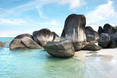 Natural rock formation in the sea and on a white sand beach in Belitung Island in the morning, Indonesia.の写真素材