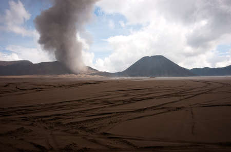 Brown sandy foot of the active Volcano mount Bromo early in the morning at the Tengger Semeru National Park in East Java, Indonesia.の写真素材