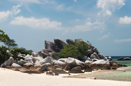 Natural rock formation on white sand beach at the coast in Belitung Island in the afternoon, Indonesia.の写真素材