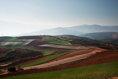 Panoramic view of chinese agriculture landscape with mountains and hills in the morning.の写真素材