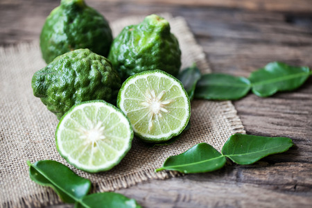 bergamot on sackcloth and wooden backgroundの写真素材