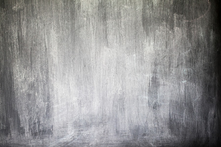 Rubbed out chalk on blackboard, close upの写真素材