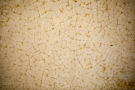 Close-up of cracked paint texture, light brownの写真素材