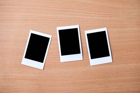 photo frame on wooden backgroundの写真素材